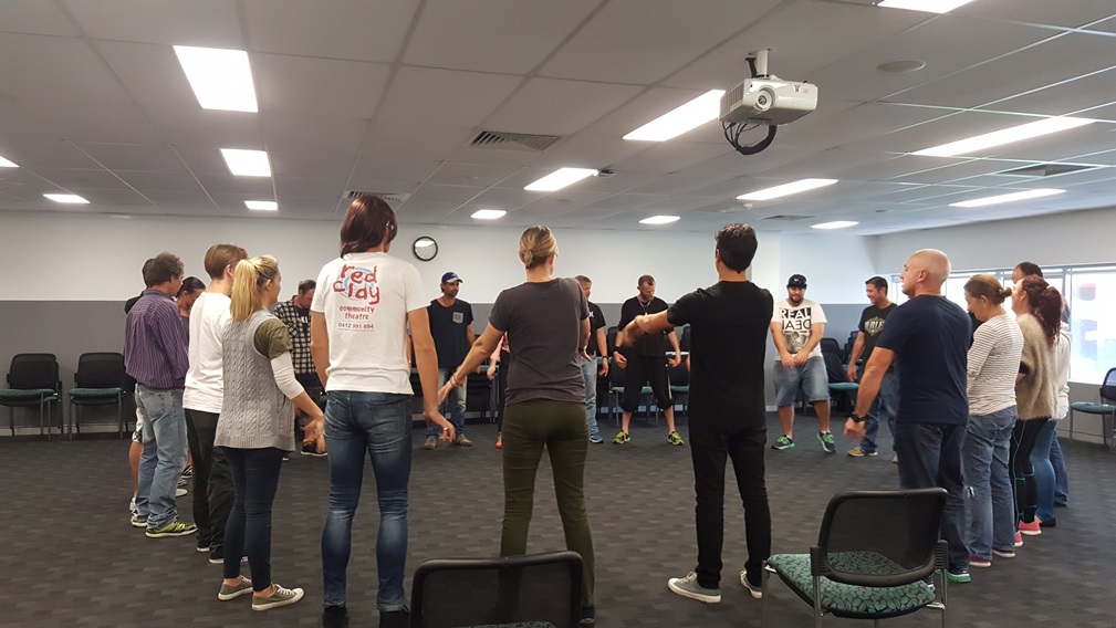 Group of participants standing in a workshop